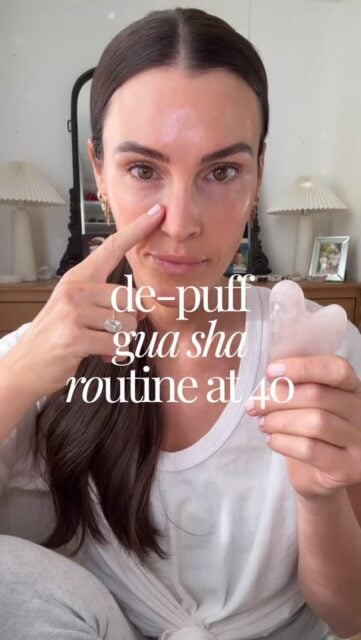 My morning de-puff gua sha routine at 40🧖🏻‍♀️ This is a modality that has helped keep my face more snatched and fine lines a little softer, especially with no Botox. Essentually you are moving fluid (de-puffing) and releasing muscle tension✔️✔️

I first apply one of my favorite oils so the stone can easily slide. Then I open up my lymph nodes to get everything flowing by tapping or little circles in these 5 locations: arm pit, above collar bone, around ears, bridge of nose and in between my eyebrows! Now it’s time to gua sha!!👏🏻 I do each move/part of my face 10 times👇🏻
+ jaw 
+ mid face 
+ cheek bones
+ under eye (lightly)
+ brow bone
+ in between brows
+ forehead

Comment “BEAUTY” and I’ll send you the exact gua sha I have (Amazon) and oils I love!🧖🏻‍♀️

#guasha #guashatutorial #cleanbeautyproducts